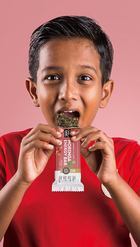 boy eating energy bar amp